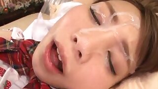 Cum drips down an exposed teen's face after a intense session